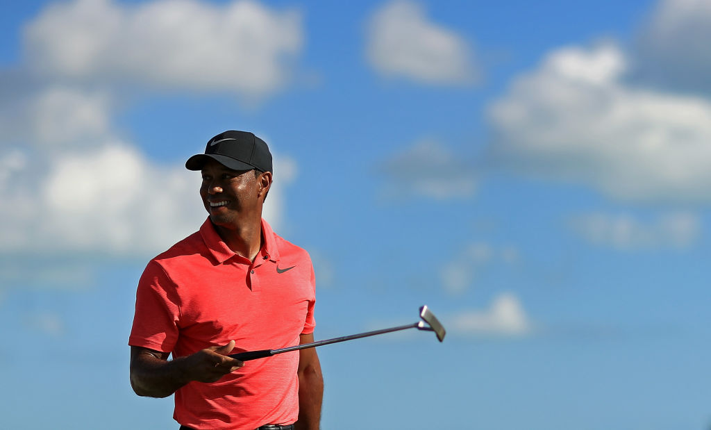 Tiger Woods on palannut hymyilevänä miehenä golfkentille